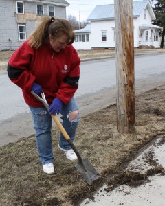 Lisa Brown edges the sidewalk at the Habitat site.